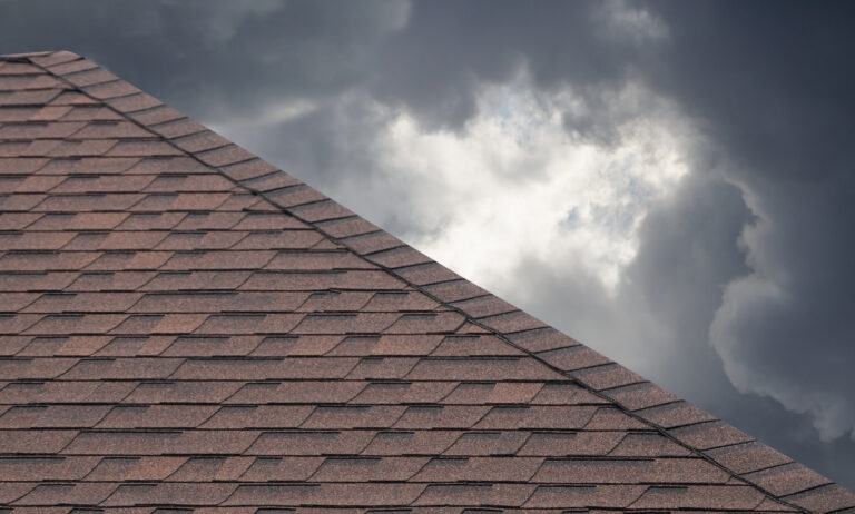brown roof shingle on cloudy day in rainy season