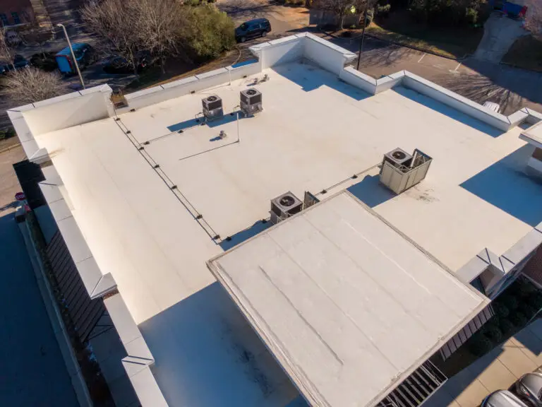 Aerial Drone View of Commercial Buildings with White TPO Roofing Systems